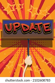 Hand holding banner with Update text. Man showing billboard.