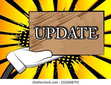 Hand holding banner with Update text. Man showing billboard.