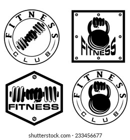 hand holding barbell and kettlebell in emblems of fitness
