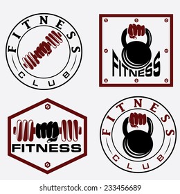hand holding barbell and kettlebell in emblems of fitness