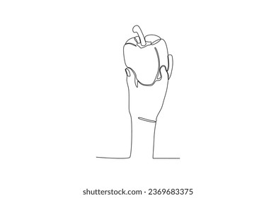 A hand holding a bell pepper. World vegan day one-line drawing