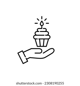 Hand holding birthday cupcake with burning candle. Pixel perfect, editable stroke icon