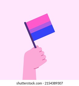 Mano con bandera bisexual. Concepto de celebración del mes del orgullo. Ilustración del vector