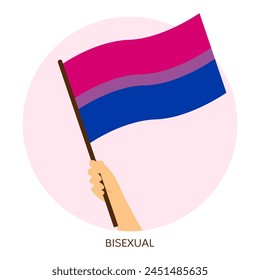 Hand holding bisexual pride flag