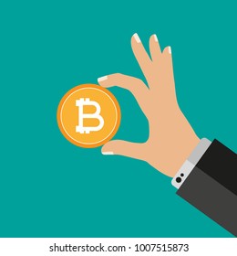 Hand holding bitcoin