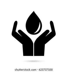 Hand holding black drop on white background.