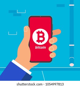 Hand holding black mobile phone with bitcoin symbol icon on the screen isolated on light blue wall background. Smartphone in human's hand vector illustration flat design style mining concept sign.