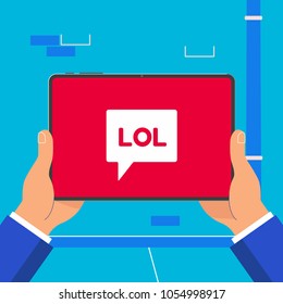 Hand holding black tablet device isolated on wall background. Pad tablet on human's hand with lol word icon symbol sign on the screen flat design vector illustration. Concept of chatting in  bubbles.