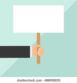 Hand holding blank paper, a sign or blank poster