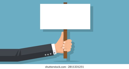 Hand holding blank protest placard with empty display board isolated on blue background suitable for campaigns announcements advertising demonstrations presentations awareness events and communication design templates.