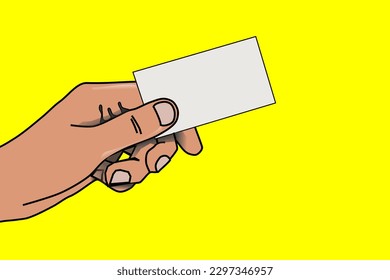 A hand holding a blank white business card on a yellow background.