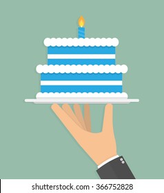 Hand holding blue birthday cake on a silver serving tray with burning candle stick on it. Flat design