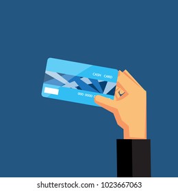 Hand holding blue credit card vector design for business finance.