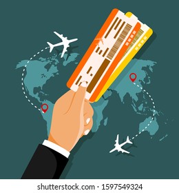 Hand holding boarding pass tickets. 