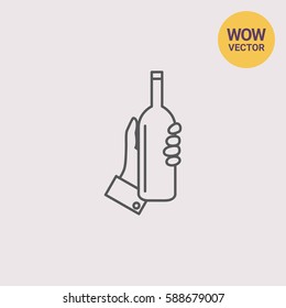 Hand holding bottle
