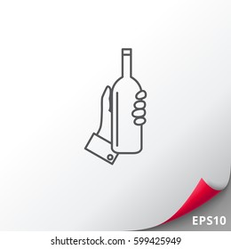 Hand holding bottle