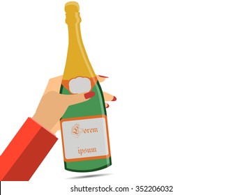 Hand holding a bottle of champagne. Female hand. Wine.