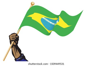 The hand holding the Brazil flag.