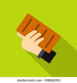 Hand holding a brick icon. Flat illustration of hand holding a brick vector icon for web isolated on lime background