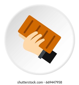 Hand holding a brick icon in flat circle isolated on white background vector illustration for web
