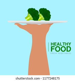 Hand holding a brocoli. Healthy food concept. Vector illustration design