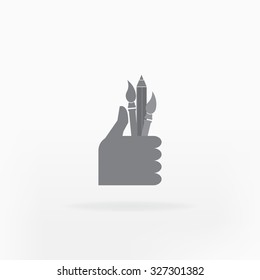 Hand holding brush