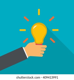 Hand holding the bulb. Idea concept. Creative idea in light bulb. Vector flat design illustration.