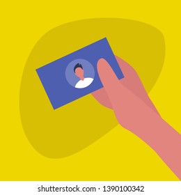 Hand holding a business card with a portrait of young caucasian male character. Your text here. Template / flat editable vector illustration, clip art