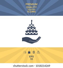Hand holding a cake icon