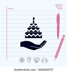 Hand holding a cake icon