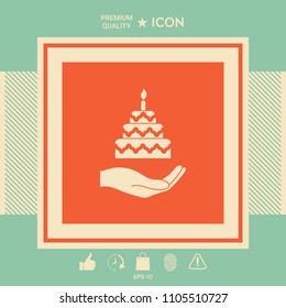 Hand holding a cake icon