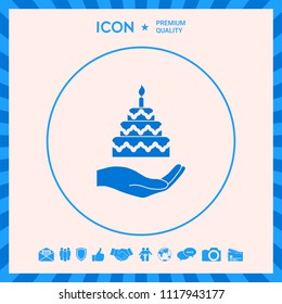 Hand holding a cake icon