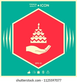 Hand holding a cake icon