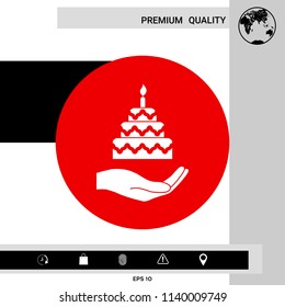 Hand holding a cake icon