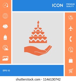 Hand holding a cake icon
