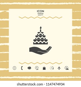 Hand holding a cake icon