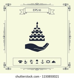 Hand holding a cake icon