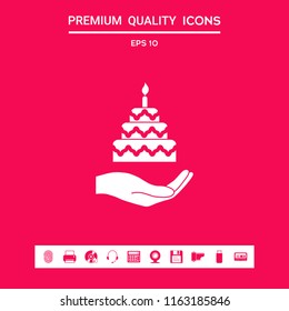 Hand holding a cake icon
