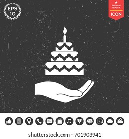 Hand holding a cake icon