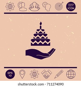 Hand holding a cake icon