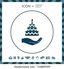 Hand holding a cake icon