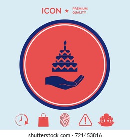 Hand holding a cake icon