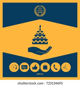 Hand holding a cake icon