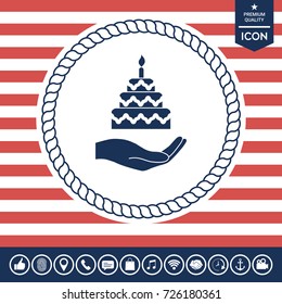Hand holding a cake icon