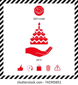 Hand holding a cake icon