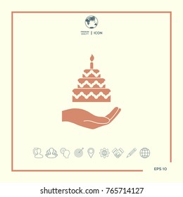 Hand holding a cake icon
