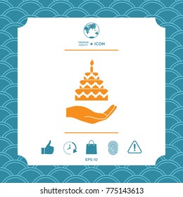 Hand holding a cake icon