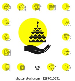 Hand holding a cake icon. Graphic elements for your design