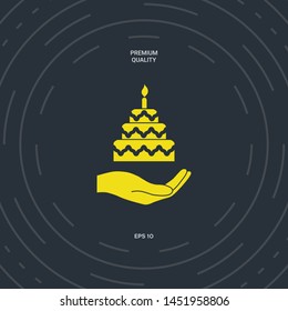 Hand holding a cake icon. Graphic elements for your design