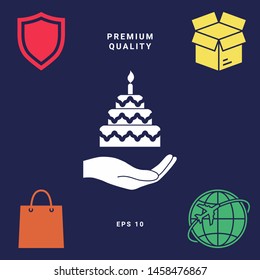 Hand holding a cake icon. Graphic elements for your design